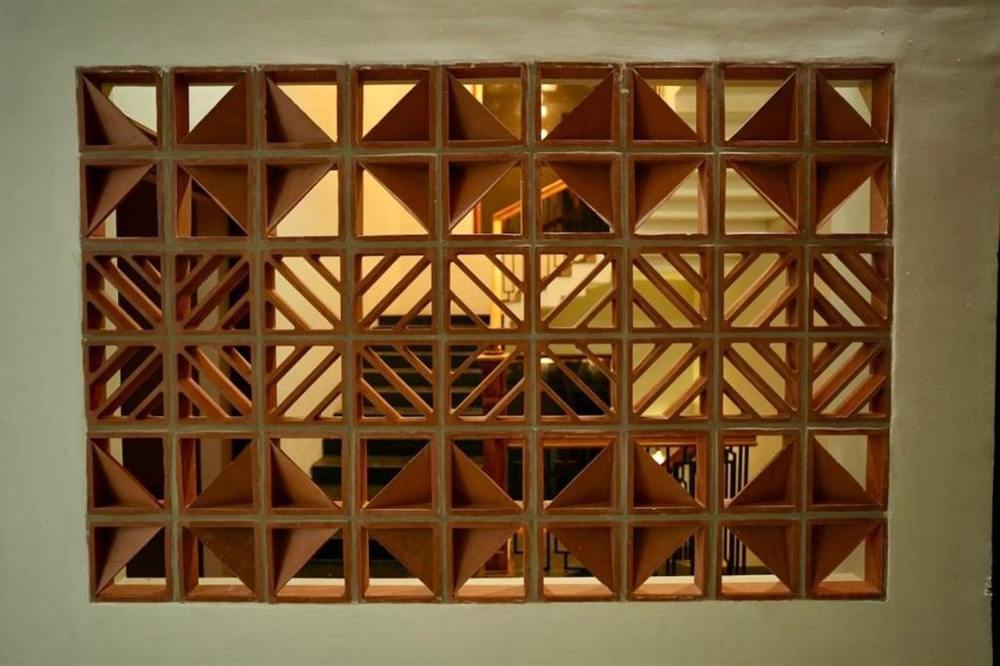 Perforated terracotta jaali screen wall